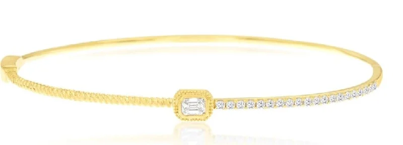 women’s hand-stamped bracelets-14k Yellow gold center emerald cut diamond hinged bangle